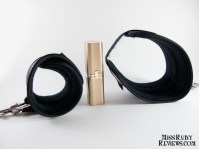 Wrist cuffs and lipstick case for scale - left is smallest cuff can be, right is largest it can be